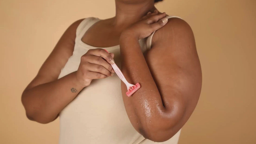 Lifestyle product Carmesi Disposable Body Razor being used for painless hair removal.